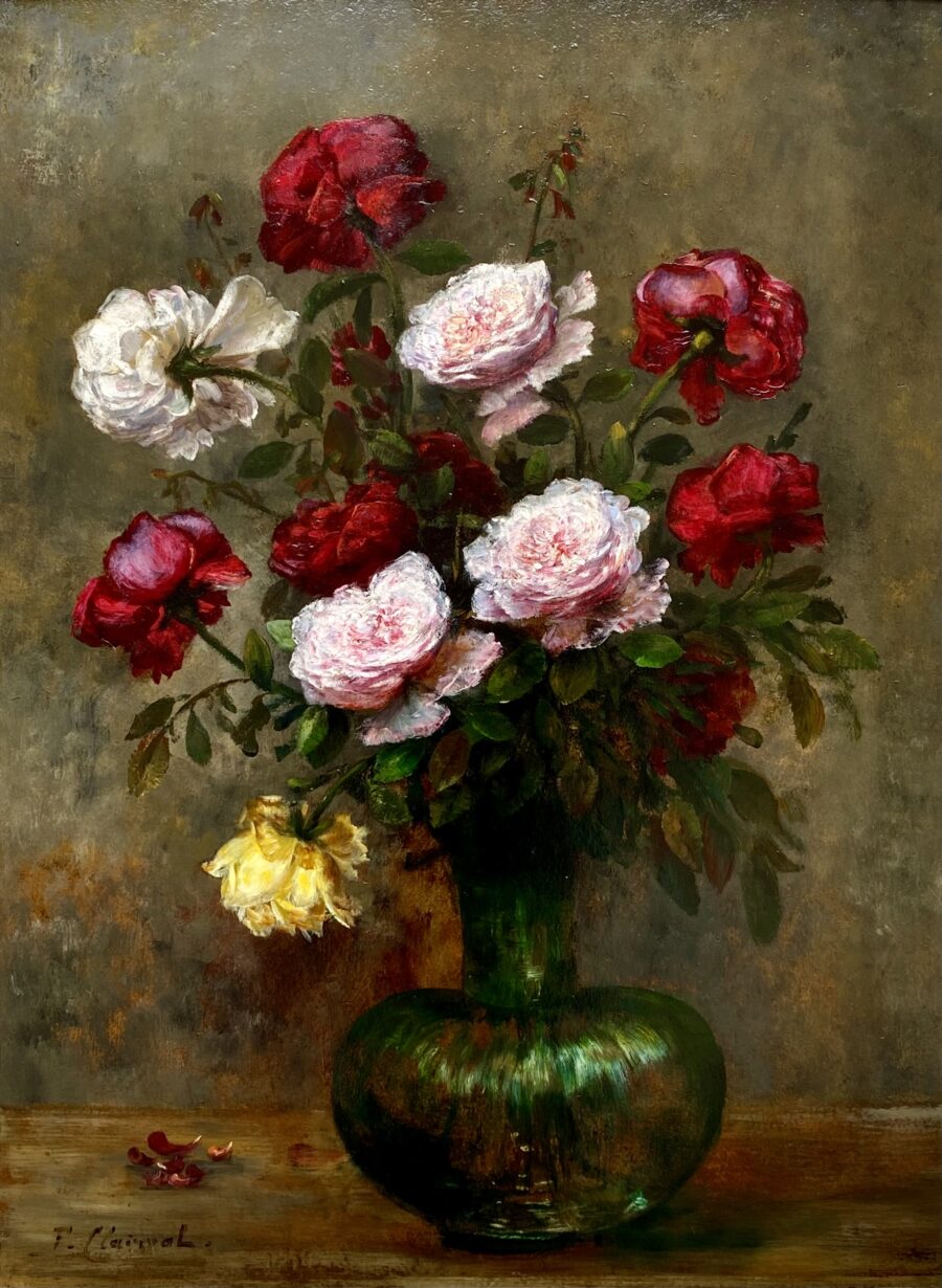 Various colourful roses in a glass vase